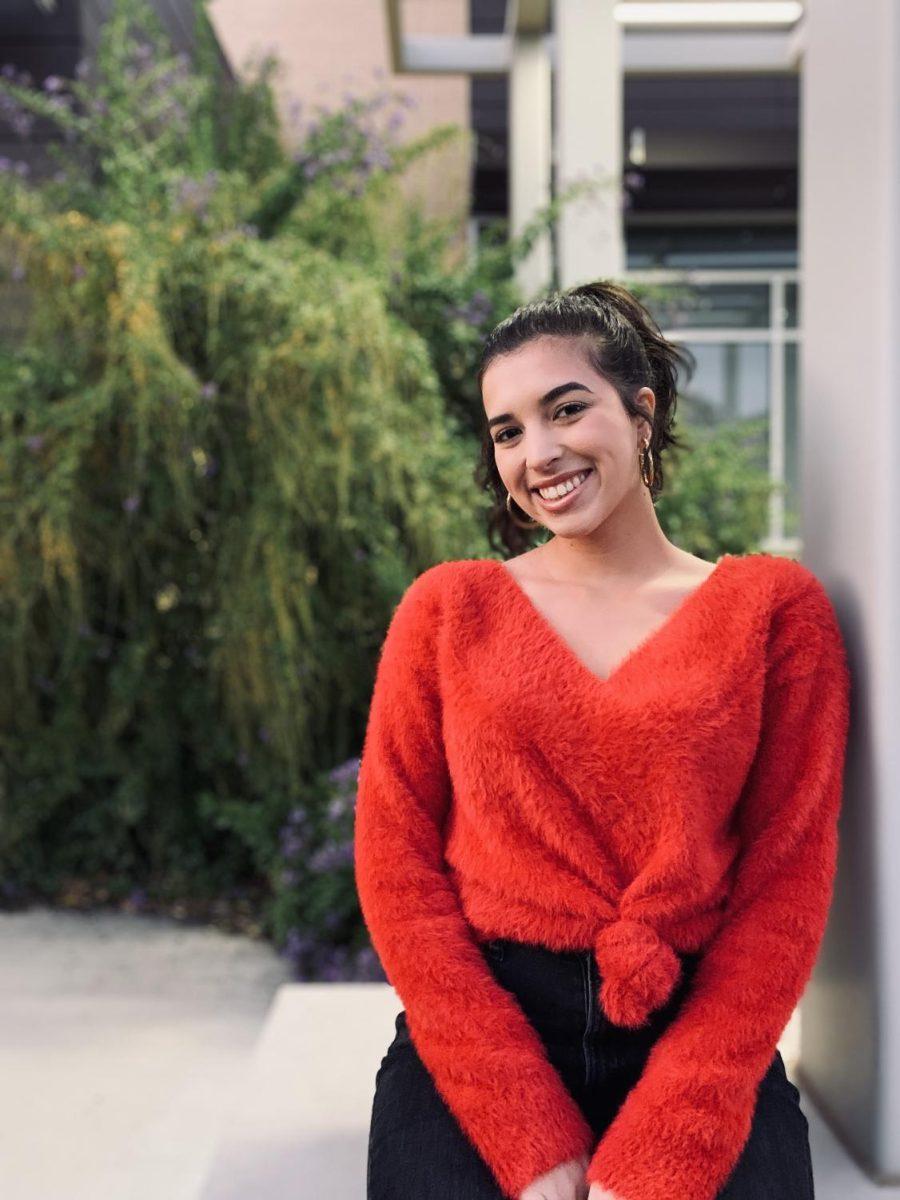Bella Lopes smiles for a photo, Dec. 2019, outside of The University Star newsroom. As engagement editor, Bella lit up our newsroom with energy and sprit. She came at a time when we were tasked with establishing and building a culture our organization could be proud of.