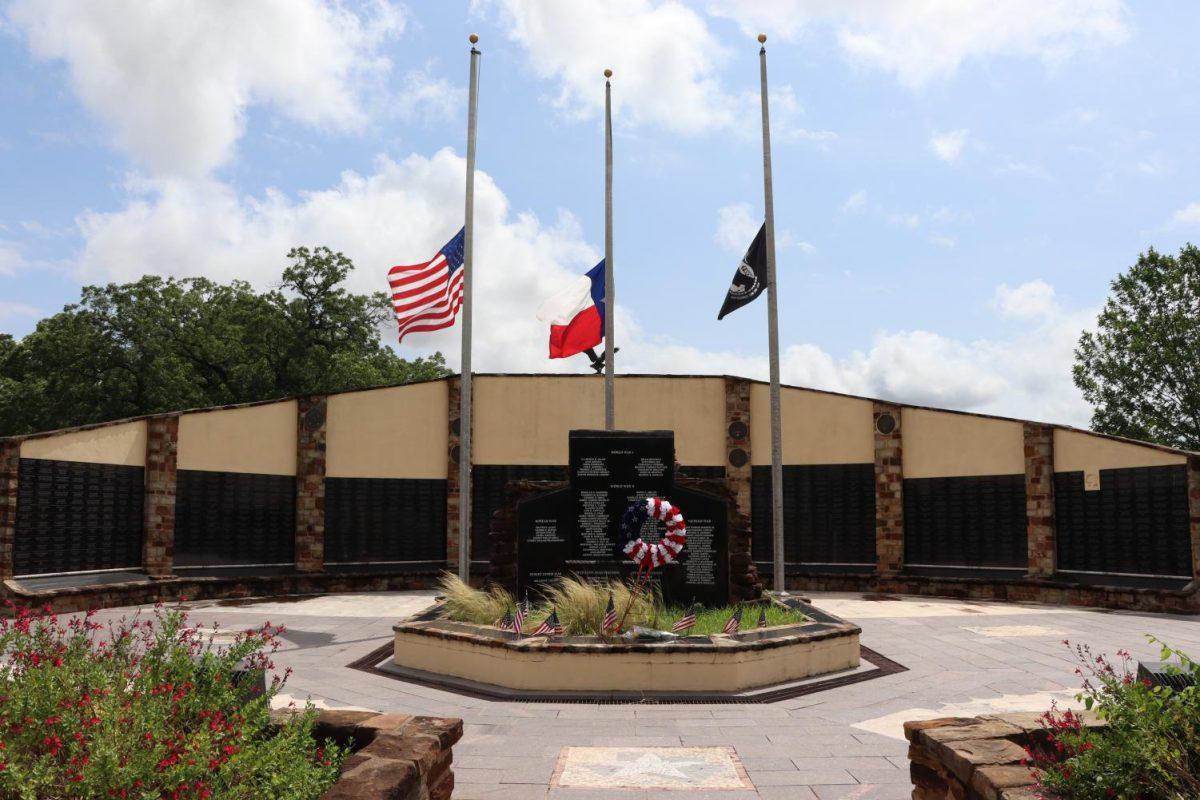The flags at the Hays County Veterans Memorial fly at half-staff in honor of Memorial Day, Monday, May 25, 2020, on the corner of Hopkins Street and Riverside Drive in San Marcos.