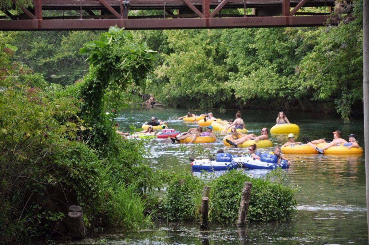 Tubers+relax+and+float+down+the+San+Marcos+River+during+the+2019+tubing+season.