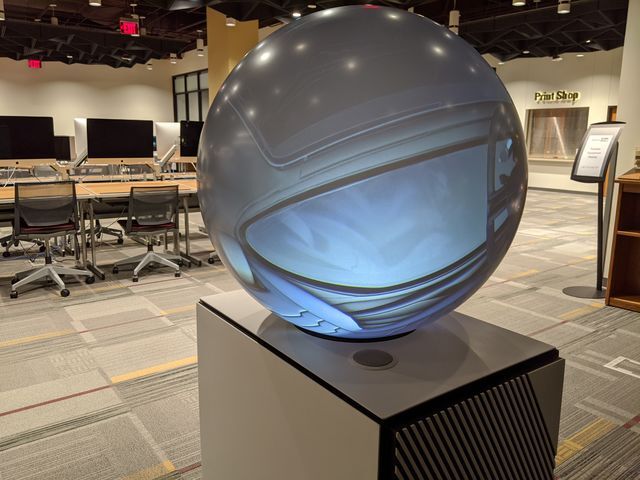 A PufferTouch globe, inside the GeoSpace, projects visualizations to an empty Alkek One at Texas State University. Alkek One is part of the $8.3 million Learning Commons Project, a series of renovations aimed at repurposing spaces in Alkek Library for students. (Ryan Scanlin)