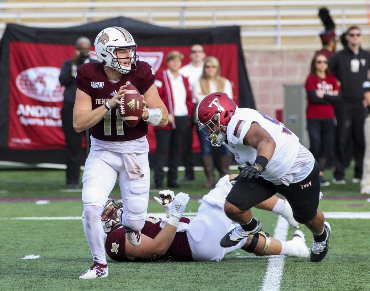 Quarterback+Tyler+Vitt+searches+for+a+teammate+to+throw+to+at+the+Texas+State+football+game+vs.+Troy%2C+Saturday%2C+Nov.+16%2C+2020%2C+at+Bobcat+Stadium.