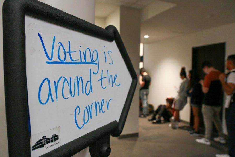 Students wait in line to vote on Super Tuesday, Tuesday, March 4, 2020, on the third floor of the LBJ Student Center at Texas State. The Hays County Commissioners Court voted to approve one out of three additional polling locations on Texas State campus — the Performing Arts Center. Photo credit: Jaden Edison