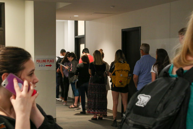 People stand and wait in a line to vote during the primary election on Super Tuesday, March 3, 2020, inside the LBJ Student Center at Texas State.