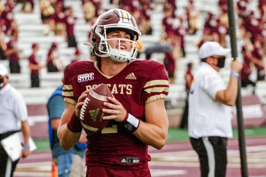 Starting quarterback Brady McBride (2) warms up on the sidelines before the home opener football game against SMU on Saturday, Sept. 5, 2020, at Bobcat Stadium. Photo credit: Kate Connors