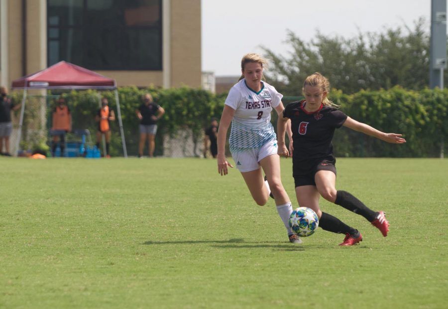 University of Louisiana at Lafayette freshman forward Lucy Ortiz (6) prepares to kick the ball down the field as Texas State senior midfielder Renny Moore (8) attempts to intercept it, Sunday, Sept. 20, 2020, at the Bobcat Soccer Complex.