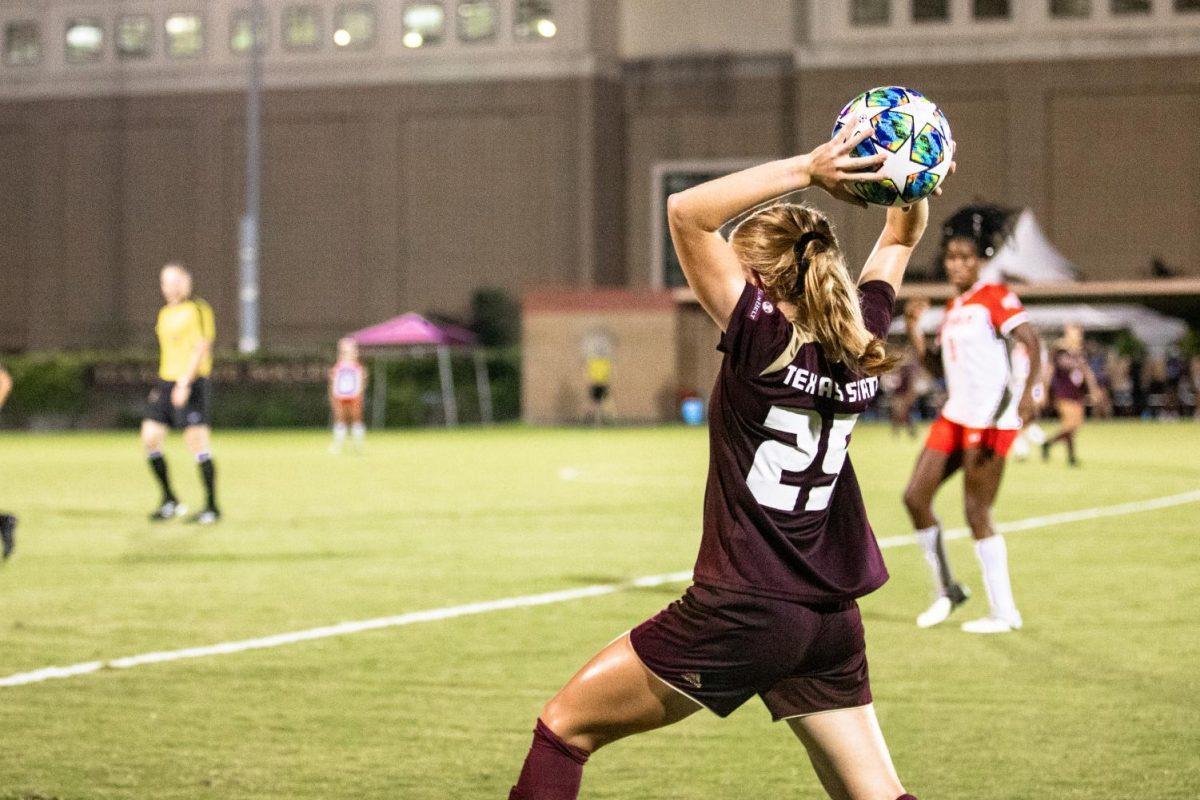Texas State freshman midfielder Emma Jones (25) throws the soccer ball back onto the field to resume the game against Lamar University, Friday, Sept. 11, 2020, at the Bobcat Soccer Complex.