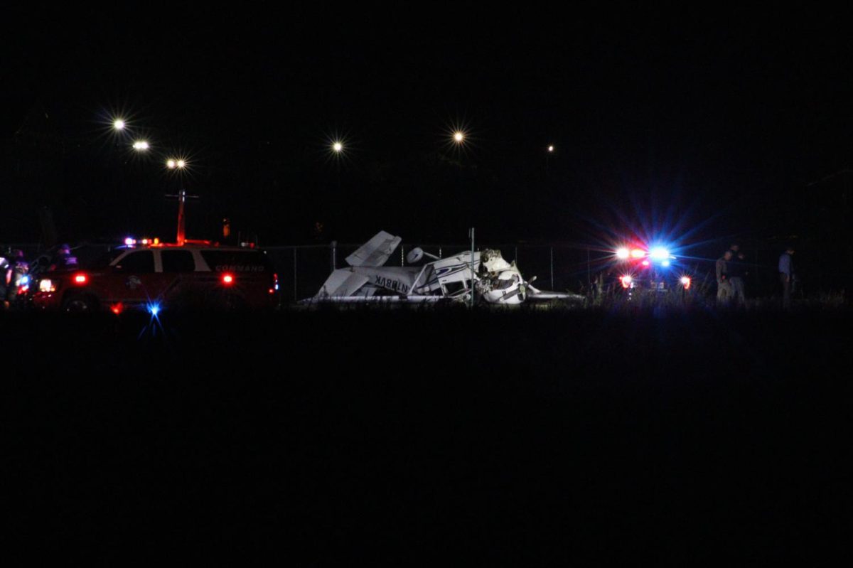 The remains of a plane involved in a crash sit within the San Marcos Regional Airport grounds, Thursday, Sept. 24, 2020, in San Marcos.