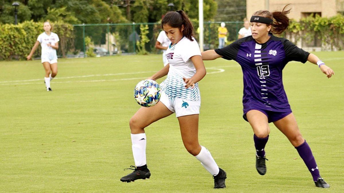 Freshman midfielder Alana Clark attempts to shield the ball from the defender in a game against Stephen F. Austin, Friday, Sept. 4, 2020, at the Bobcat Soccer Complex.