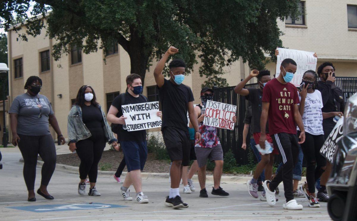 Protesters march from the Hays County Historic Courthouse to the University Police Department building, Saturday, Sept. 5, 2020, on Texas State’s campus during an organized protest in support of the Black Lives Matter movement.