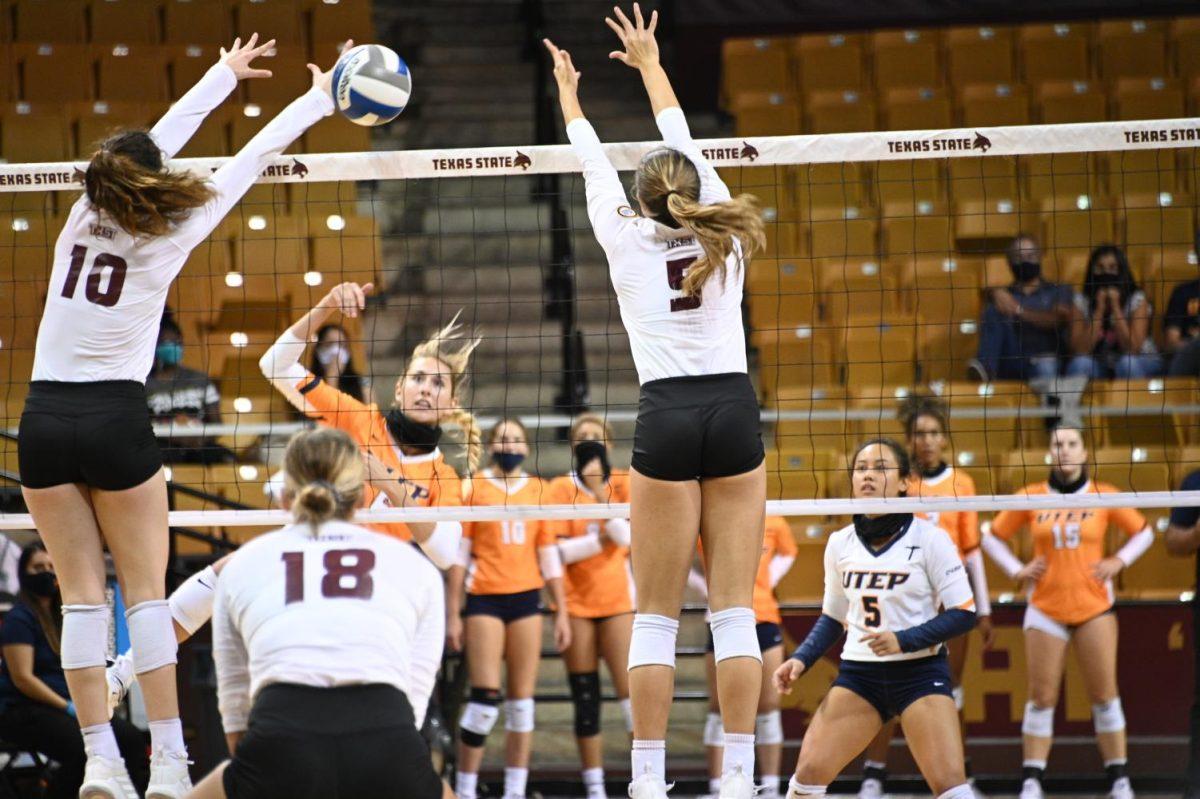 Texas+State+sophomore+outside+hitter+Caitlan+Buettner+%2810%29+and+sophomore+middle+blocker+Tessa+Marshall+%285%29+reach+to+block+the+ball+during+the+game+against+UTEP%2C+Saturday%2C+Sept.+12%2C+2020%2C+at+Strahan+Arena.