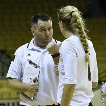 Volleyball Head Coach Sean Huiet (left) recorded his first career win in a Sept. 4 matchup against Central Arkansas.