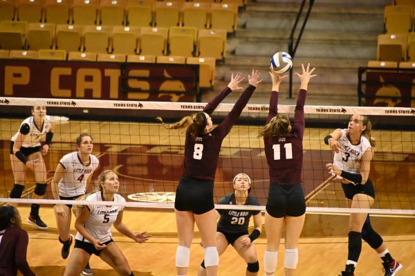 Texas State junior middle blocker Jillian Slaughter (8) and freshman outside hitter Daleigh Ellison (11) jump to block the ball during a game against the University of Arkansas at Little Rock, Friday, Oct. 23, 2020, at Strahan Arena. The Bobcats won 3-0 against the Trojans.