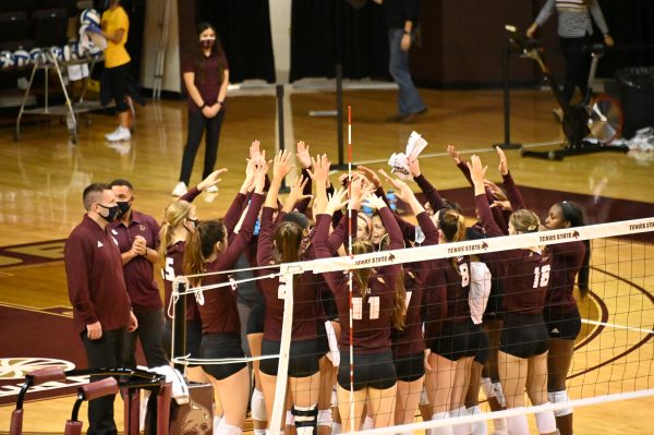 The Bobcats celebrate their win against University of Arkansas at Little Rock with a cheer, Friday, Oct. 23, 2020, at Strahan Arena. The Bobcats won 3-0 against the Trojans.