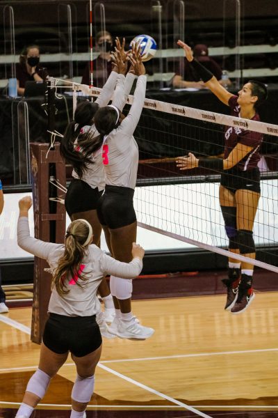 Texas State junior outside hitter Kenedi Rutherford (1) and senior middle blocker Tyeranee Scott (3) double block an incoming hit from the University of Arkansas at Little Rock Friday, Oct. 23, 2020, at Strahan Arena. The Bobcats won 3-1 against the Trojans.