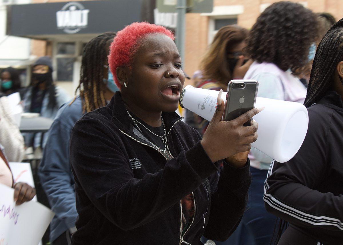 Omolayo Shorunke leads a chant during a protest organized in support of the movement to end SARS, Saturday, Oct. 24, 2020, in downtown San Marcos. The protest was in support of the movement to end the Nigerian federal police force known as the Special Anti-Robbery Squad, or SARS.