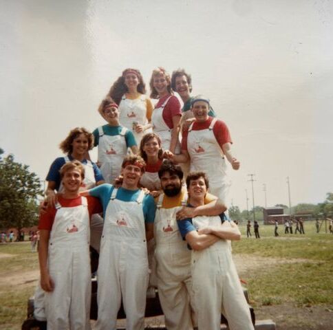 Dr. Deborah Bergeron (blue shirt, left, second from the bottom) smiles for a photo with her fellow Foxtales castmates in the 80s. Bergeron is currently the director of the Office of Head Start, a federal program created in 1965 under President Lyndon B. Johnson, and is recognized as one of the five 2020 Distinguish Alumni Award honorees.