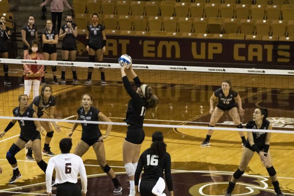 Texas State junior setter Emily DeWalt (17) jumps to set the ball across to the University of Arkansas at Little Rock during a game, Saturday, Oct. 24, 2020, at Strahan Arena. The Bobcats won 3-0 against the Trojans.
