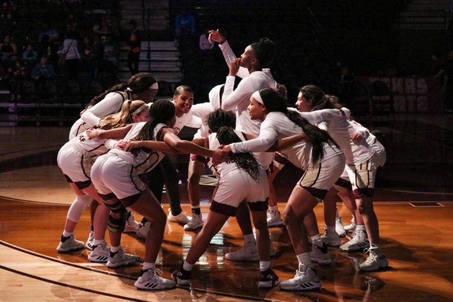 The Texas State Bobcats huddle and cheer before the start of a game against Georgia State, Saturday, Feb. 29, 2020, at Strahan Arena.