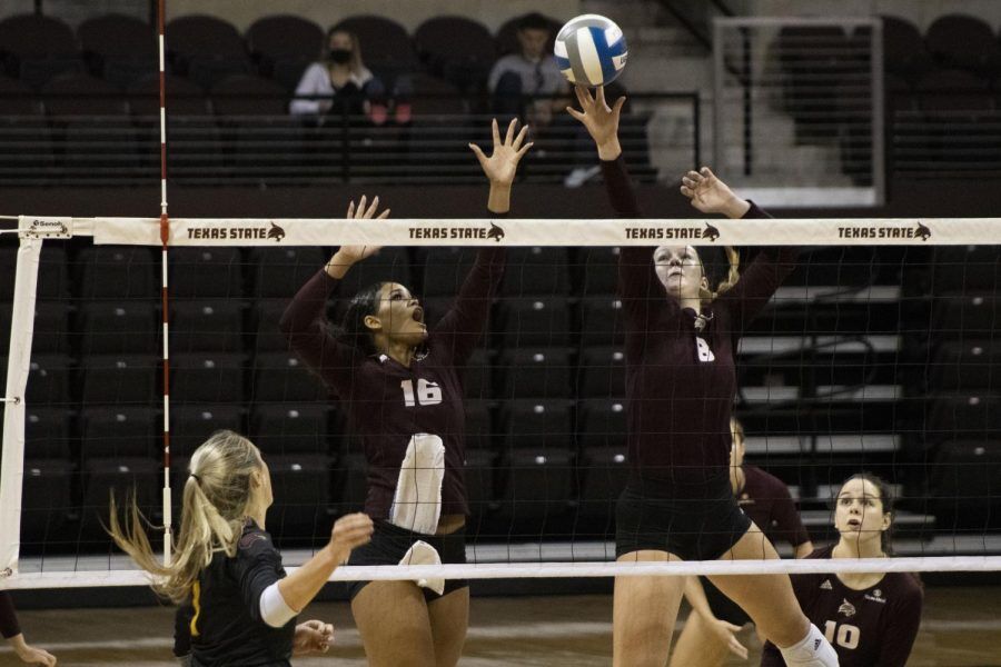 Texas+State+junior+outside+hitter+Janell+Fitzgerald+%2816%29+and+junior+middle+blocker+Jillian+Slaughter+%288%29+jump+to+tap+the+ball+over+the+net%2C+Friday%2C+Sept.+25%2C+2020%2C+at+Strahan+Arena.+Texas+State+beat+the+University+of+Louisiana+at+Monroe+3-0+%2825-13%2C+25-16%2C+25-18%29.
