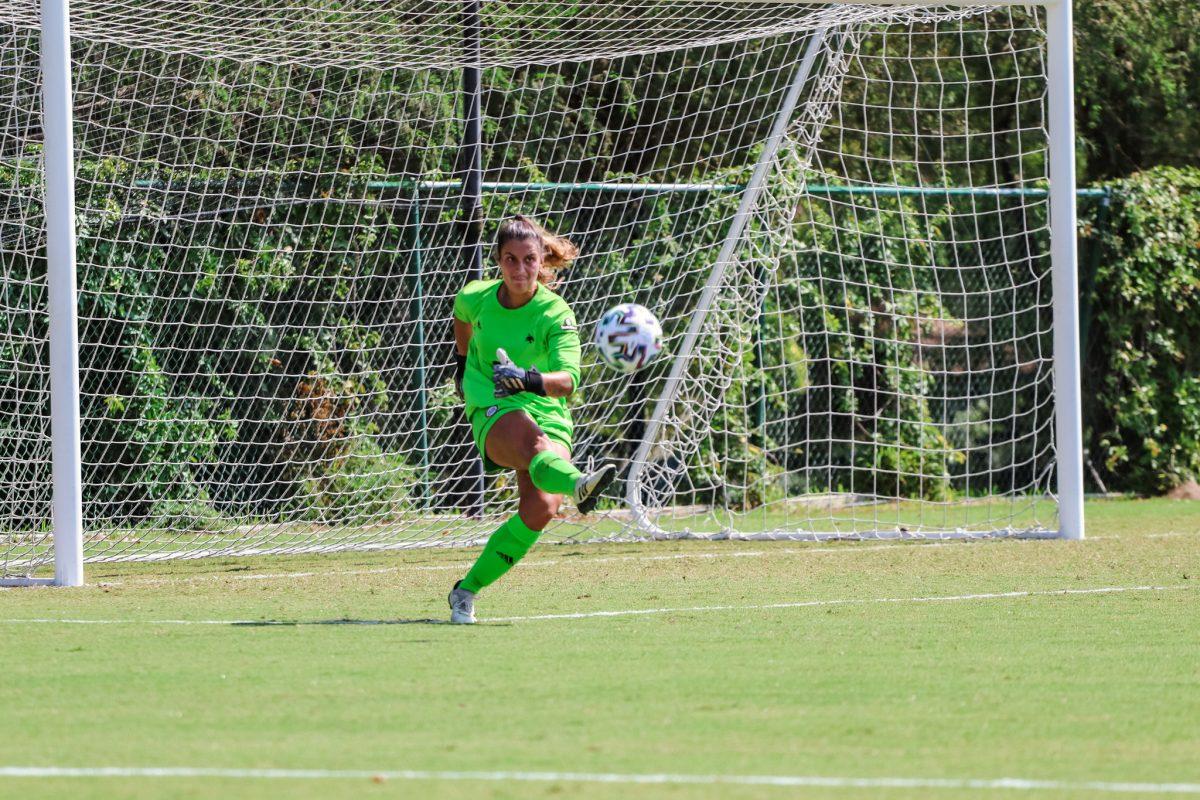 Freshman goalie Beth Agee (0) kicks the ball back into play after preventing Arkansas State from scoring, Saturday, Oct. 10, 2020, at Bobcat Soccer Complex. The Bobcats lost 1-0 in overtime.