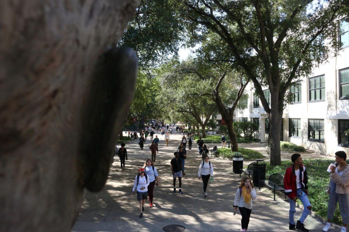 Texas State students walk to and from classes Monday, Nov. 4, 2019 near the Lyndon Baines Johnson statue.
