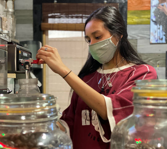 Texas State digital media and mass communication major Jennifer Ariola prepares coffee and tea for an order Oct. 9, 2020, at the LazyDaze coffee shop in downtown San Marcos.