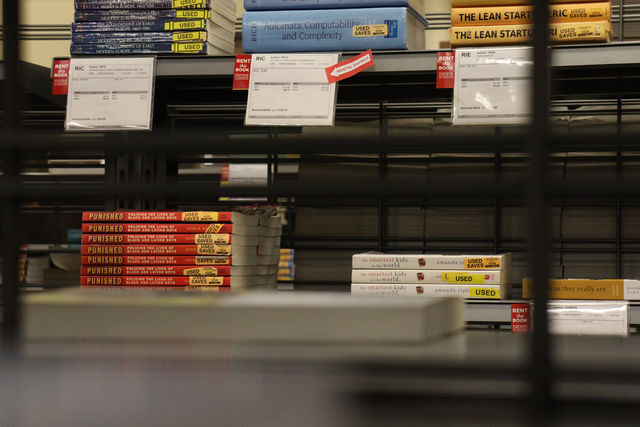 Textbooks available to purchase or rent sit on the shelves of the University Bookstore, Wednesday, Oct. 28, 2020, in the LBJ Student Center. The university has created the Managing Textbook Cost Committee to work to lower the cost of textbooks and other learning materials for students.