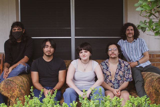 Local band Wezmer poses on a couch in front of one of the band members homes, Friday, Oct. 23, 2020, in San Marcos.