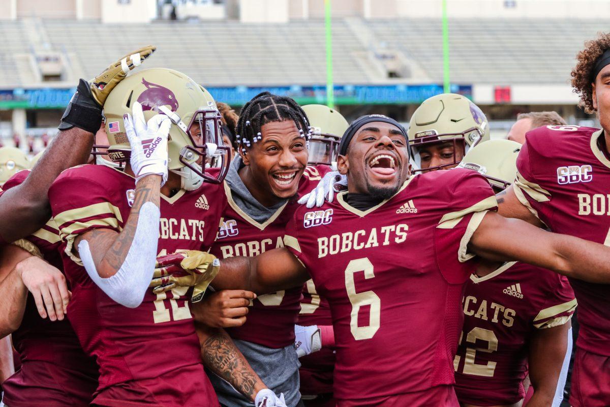 After+a+touchdown+from+Texas+State+junior+wide+receiver+Javen+Banks+%2812%29%2C+the+Bobcats+celebrate+on+the+sidelines+during+a+game+against+Arkansas+State%2C+Saturday%2C+Nov.+21%2C+2020%2C+at+Bobcat+Stadium.+Texas+State+won+47-45.
