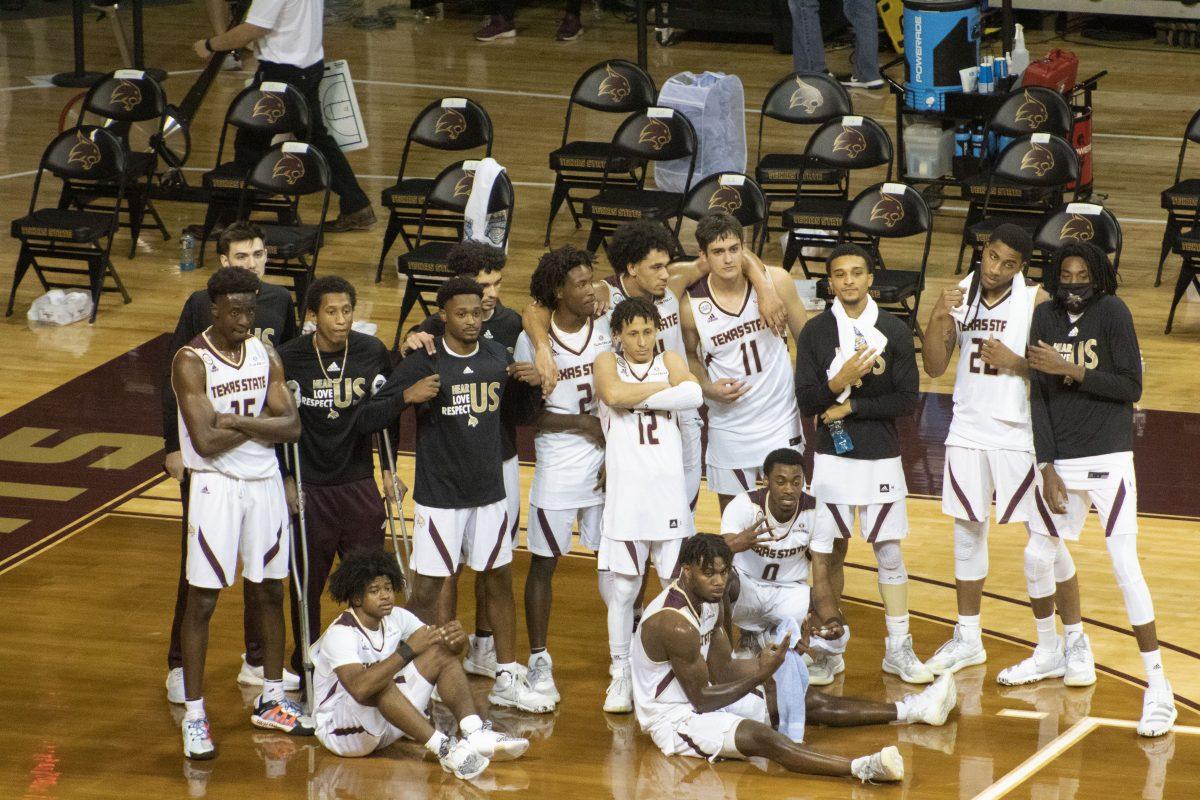 The Texas State mens basketball team poses for a picture after its opening night win against the University of Mary Hardin-Baylor, Wednesday, Nov. 25, 2020, at Strahan Arena. The Bobcats won 98-59.
