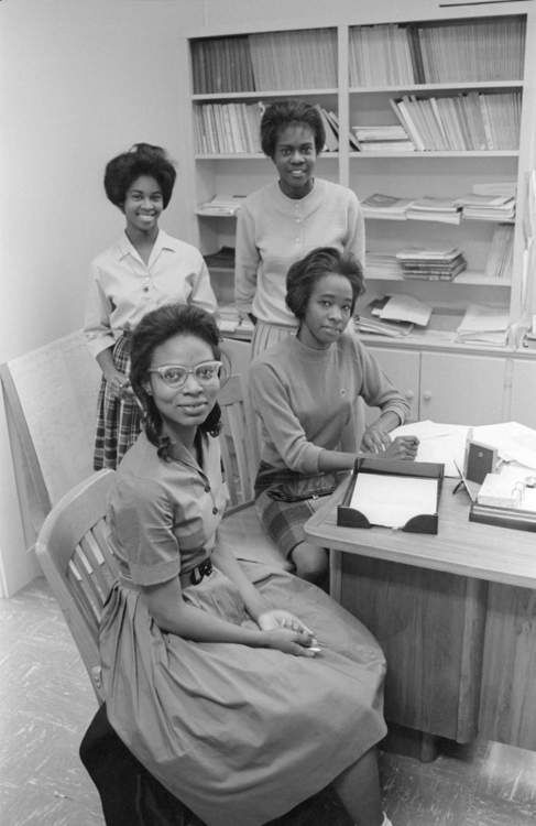 Standing left to right are Georgia Faye Hoodye and Mabeleen Washington Wozniak, while seated are Dana Jean Smith and Gloria Odoms. Along with Helen Jackson (not pictured), these five women made history as the first Black students to enroll at Southwest Texas State University.