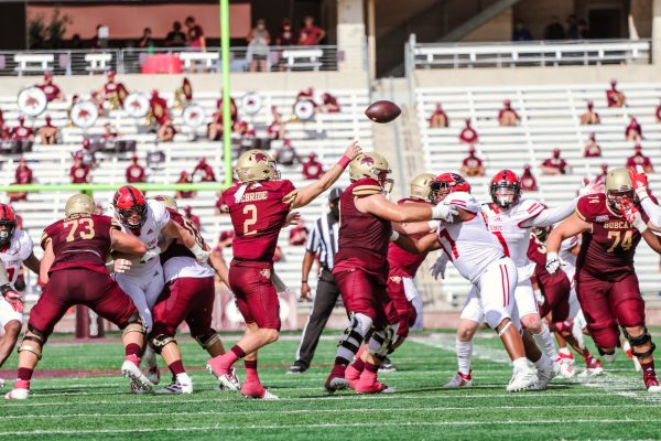 Texas State sophomore quarterback Brady McBride (2) throws the ball across the field to an open receiver while the Arkansas State defense is held back, Saturday, Nov. 21, 2020, at Bobcat Stadium. Texas State won 47-45.
