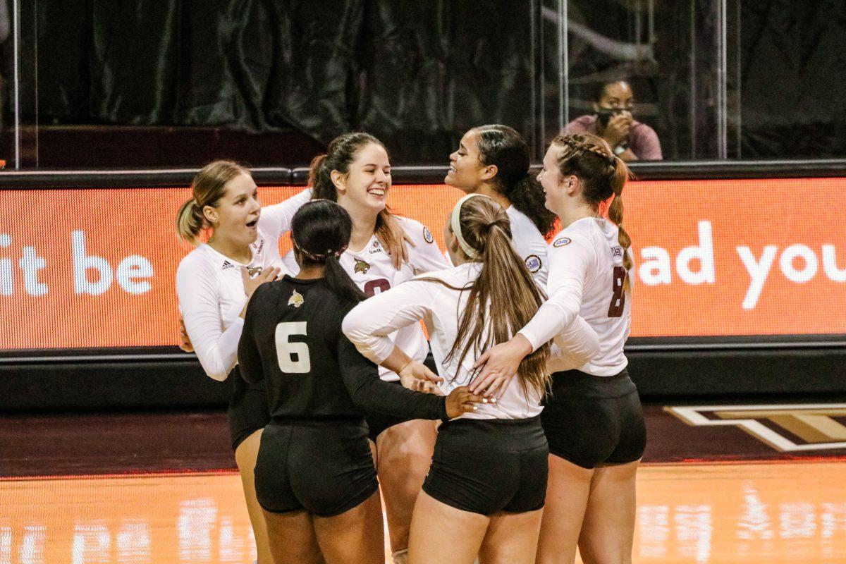The+Bobcats+celebrate+sophomore+outside+hitter+Caitlan+Buettners+%2810%29+kill+to+score+a+point+against+the+University+of+Texas+at+Arlington%2C+Friday%2C+Nov.+13%2C+2020%2C+at+Strahan+Arena.+The+Bobcats+swept+the+Mavericks+3-0.