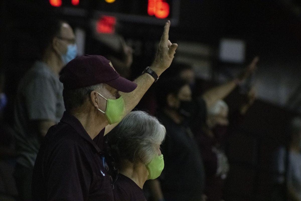 Texas State fans raise their hands to make the Texas State hand sign as the womens volleyball team reaches match point in their last set, Friday, Sept. 25, 2020, at Strahan arena. Texas State beat the University of Louisiana at Monroe 3-0.