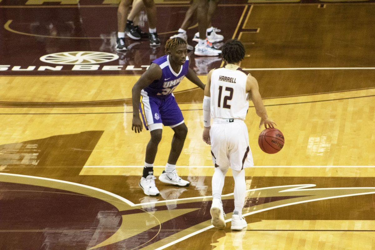 Texas State junior guard Mason Harrell (12) dribbles up the court against the University of Mary Hardin-Baylor defenders, Wednesday, Nov. 25, 2020, at Strahan Arena. Texas State won 98-59.