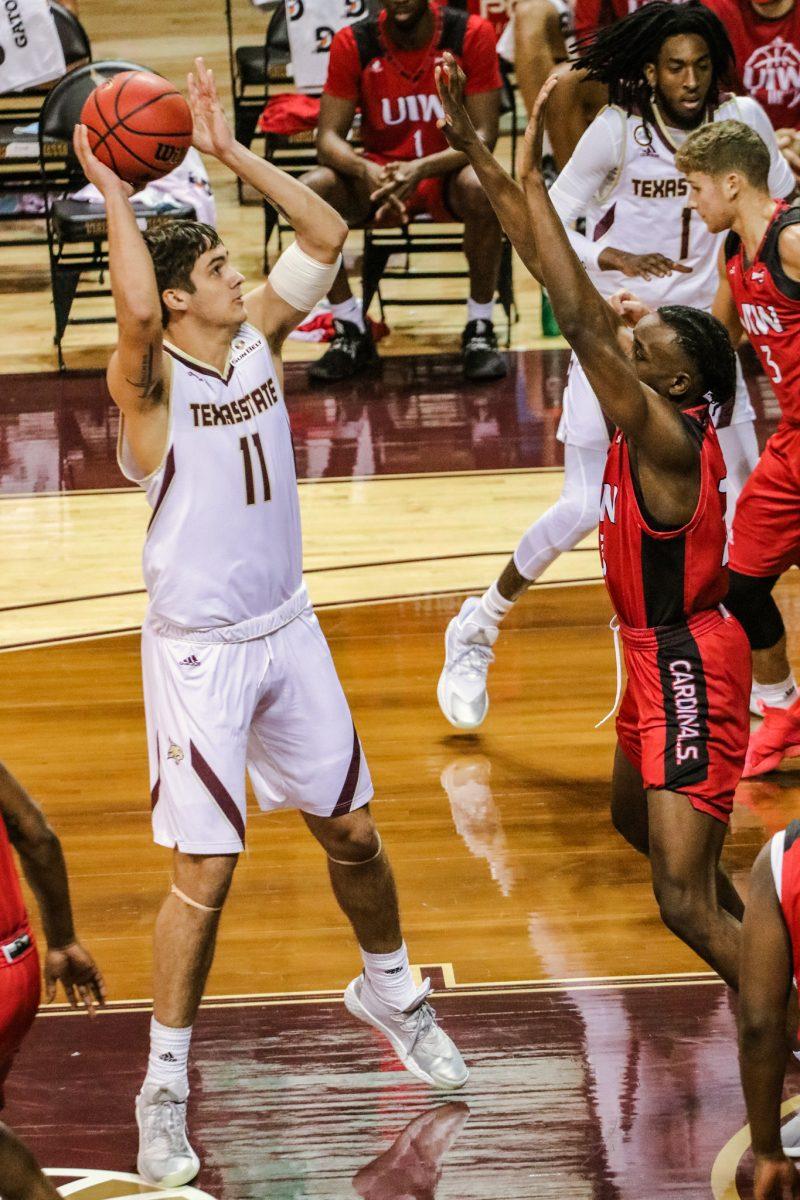 Texas State freshman forward Nate Martin (11) shoots the basketball to score for the Bobcats in their game against Incarnate Word Saturday, Dec. 5th, 2020 at Strahan Arena. The Bobcats won 72-64.