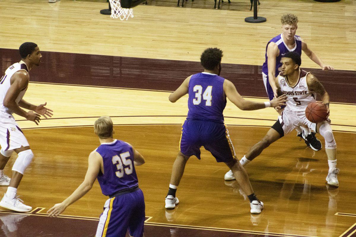 Texas State graduate guard Marlin Davis (5) dribbles along the baseline against the University of Mary Hardin-Baylor, Wednesday, Nov. 25, 2020, at Strahan Arena. The Bobcats won 98-59.