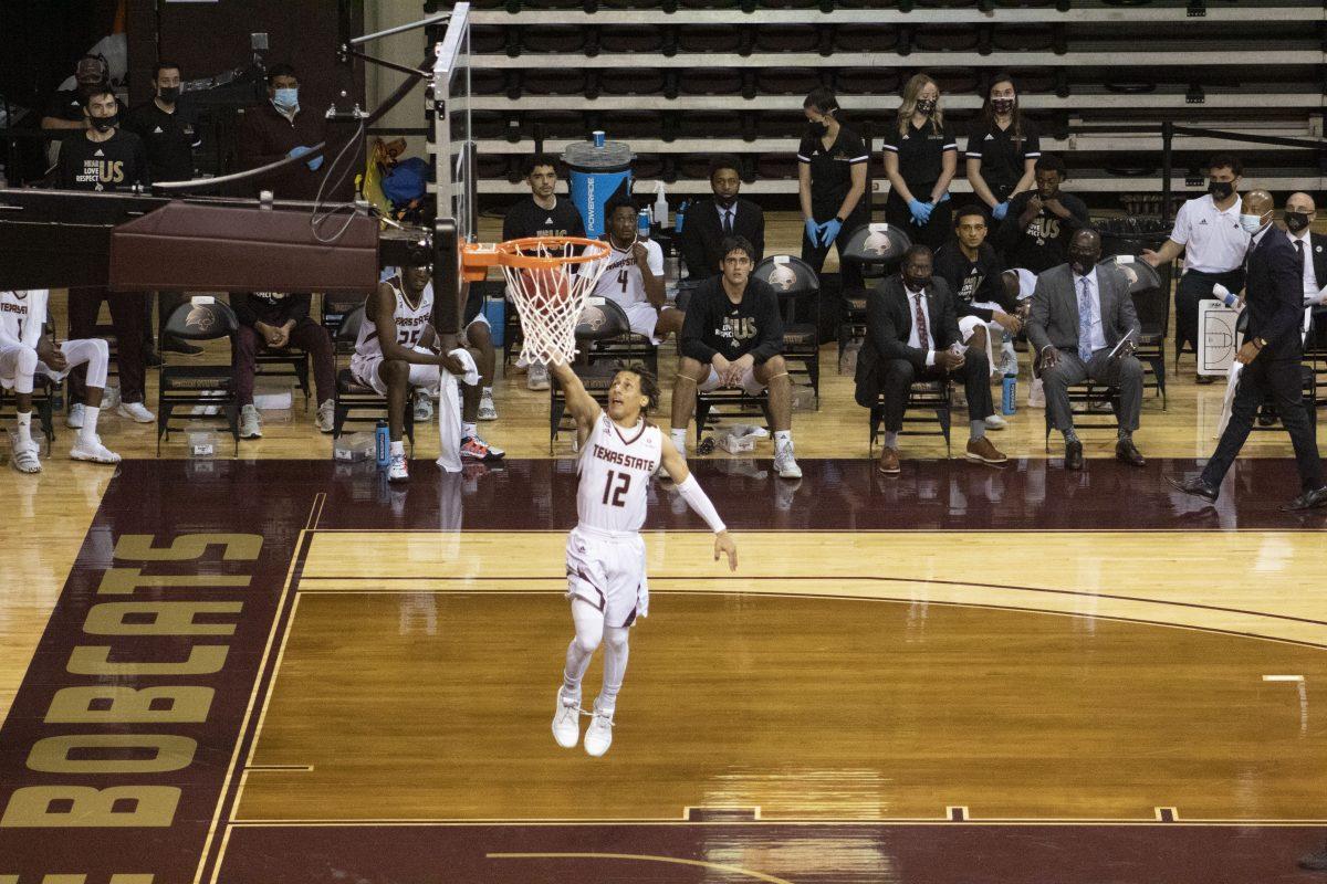 Texas+State+junior+guard+Mason+Harrell+%2812%29+converts+a+layup+on+the+fast+break+against+the+University+of+Mary+Hardin-Baylor%2C%26%23160%3BWednesday%2C+Nov.+25%2C+2020%2C+at+Strahan+Arena.+The+Bobcats+won+98-59.