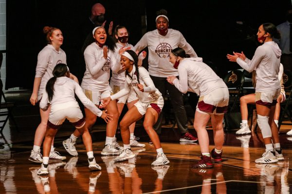 The Bobcats cheer on senior guard Avionne Alexander (1) as her name is called as a starter before the game against Lamar University, Saturday, Dec. 19, 2020, at Strahan Arena. The Bobcats won 69-53.
