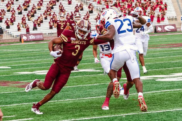 Texas State senior wide receiver Jeremiah Haydel pushes back a Southern Methodist University defender while running upfield, Saturday, Sept. 5, 2020, at Bobcat Stadium.