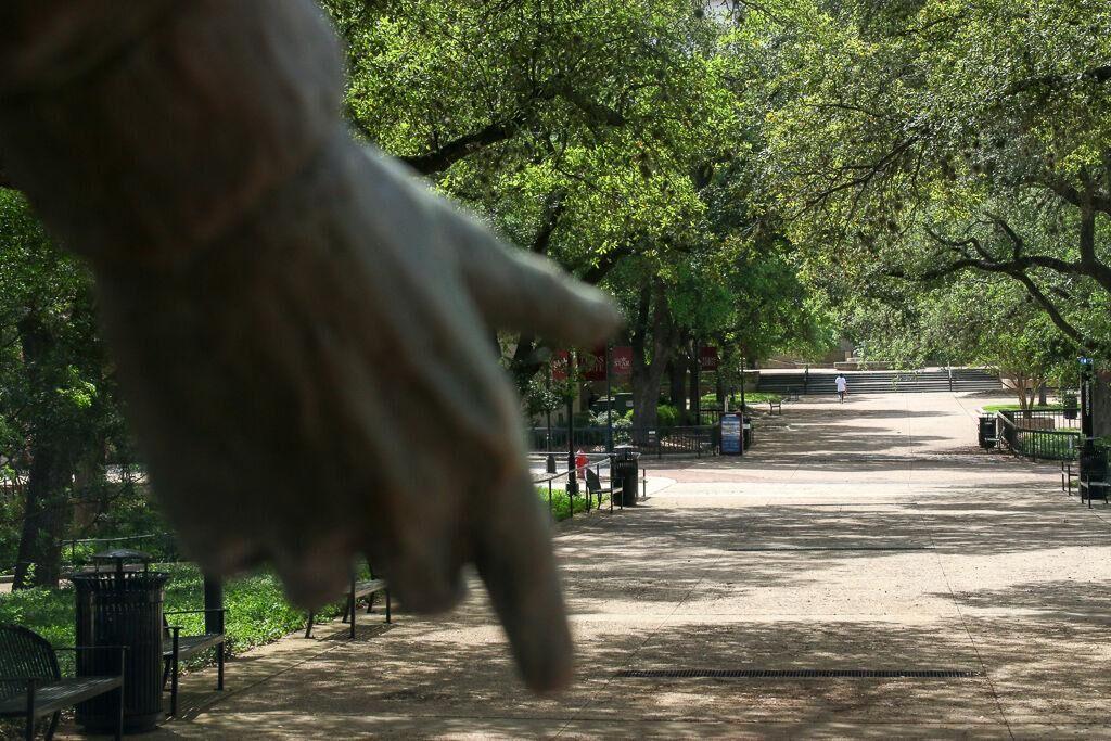A person walks through the Quad, Tuesday, March 31, 2020, at Texas State.