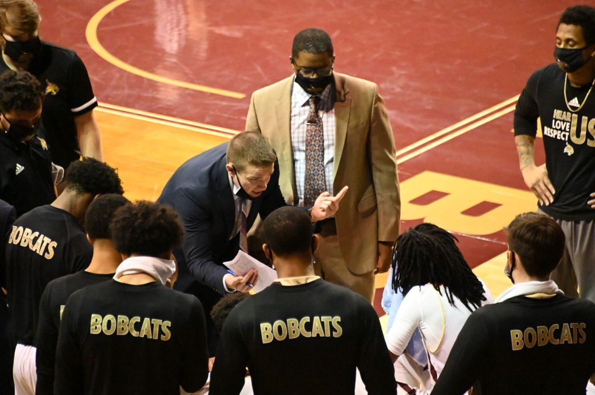 Texas State Assistant Coach Dylan Johnson addresses the Bobcats during a break, Tuesday, Dec. 15, 2020, at Strahan Arena. Texas State won the game 51-46.