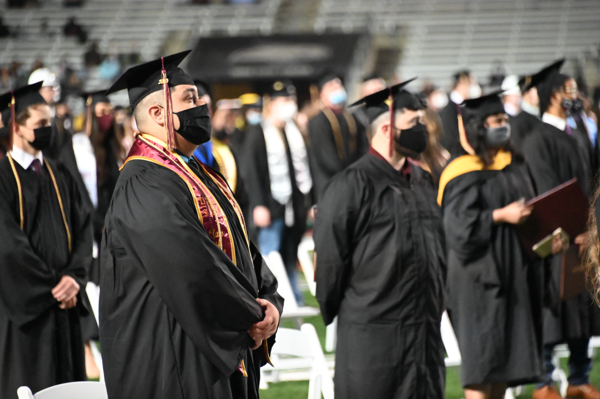 Texas State graduates sit in rows during the commencement ceremony, Friday, Dec. 11, 2020, at Bobcat Stadium.