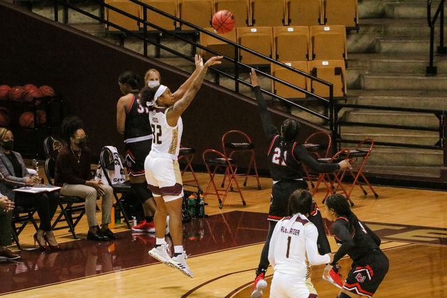 Texas State junior forward DaNasia Hood (32) jumps and shoots the basketball over a University of Louisiana defender, Friday, Jan. 1, 2021, at Strahan Arena.