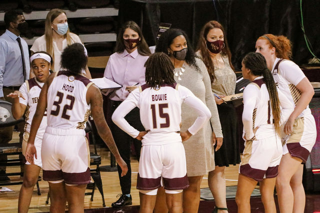 Texas State Head Coach Zenarae Antoine talks to players during a timeout in a game against Lamar University, Saturday, Dec. 19, 2020, at Strahan Arena.