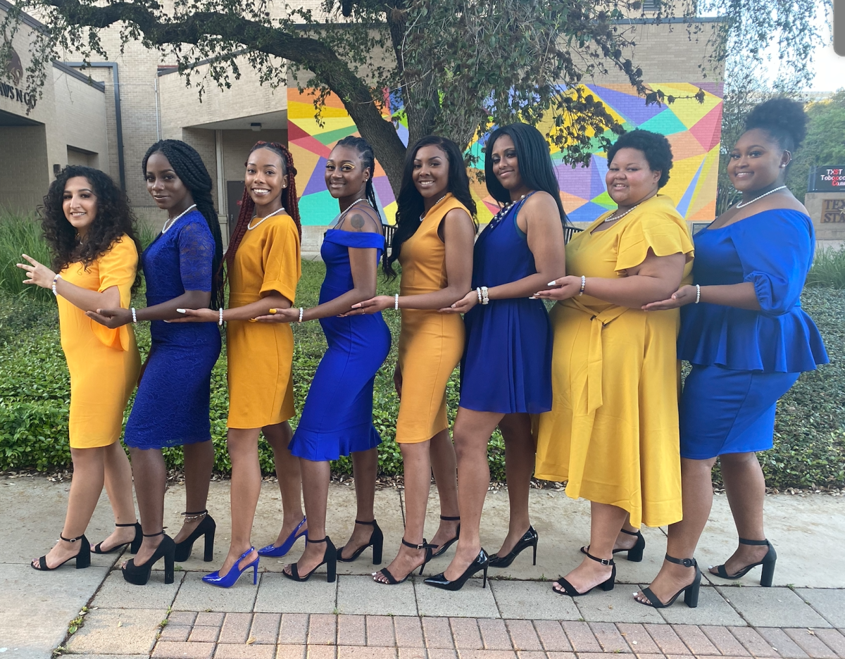 Sigma Gamma Rho Sorority sisters (from left to right) Jeanette Pedraza, Anna Howe, Charnae Brown, Shania Richardson, Aríana Curran, Kayla Stanton, Alexus Robinson and Devine Ellison stand together on the Quad after a meeting pre-pandemic.