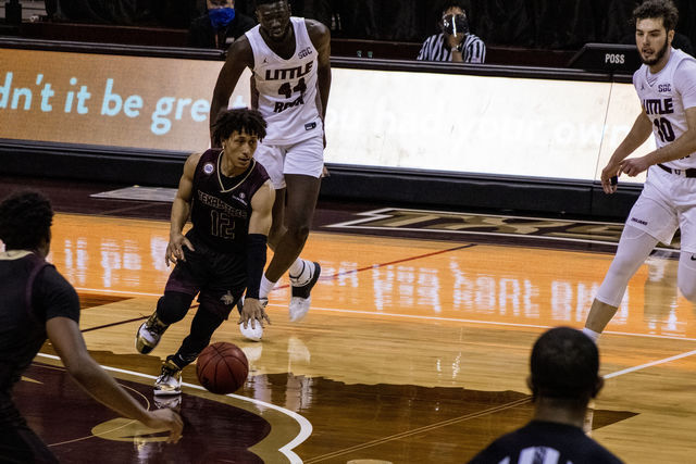 Texas State junior guard Mason Harrell (12) dribbles down the offense while he looks for an open lane to the basket in a game against the University of Arkansas at Little Rock, Saturday, Feb. 6, 2021, at Strahan Arena. The Bobcats won in overtime 77-67.