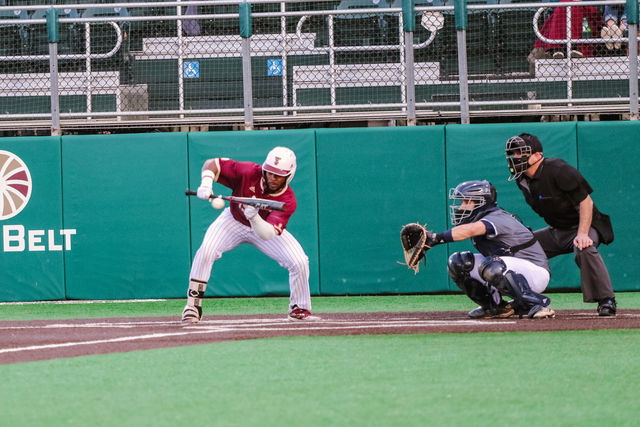 Texas State sophomore outfielder Ben McClain (19) prepares to bunt the incoming Rice pitch, Wednesday, March 17, 2021, at Bobcat Ballpark.
