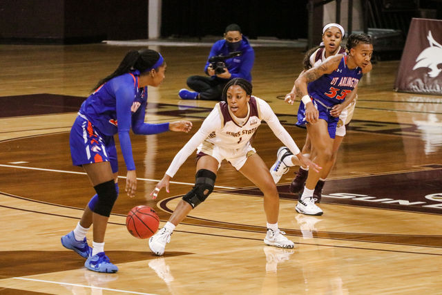 Texas State senior guard Avionne Alexander (1) tracks a UTA player who dribbles down the court during the first quarter of the game, Friday, Feb. 12, 2021, at Strahan Arena. The Bobcats won 66-45.