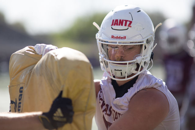 Texas State freshman wide receiver Dylan Jantz (81) pushes back on training equipment and a teammate during a spring practice drill, Thursday, March 25, 2021, at Bobcat Stadium.
